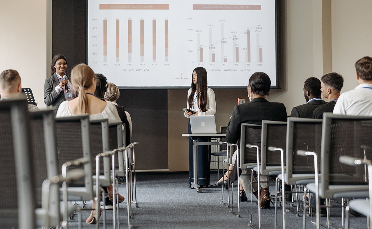 Group of business people listening to a presentation