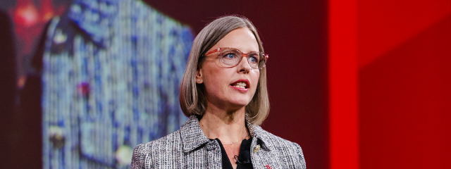 Kristona Logue delivering opening remarks at The 2024 SUMMIT