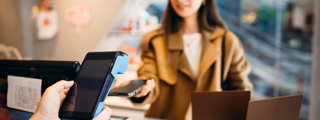 Woman paying using smart phone