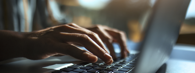 Hands on a computer keyboard