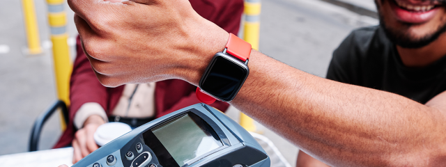 Person paying on the go with a wearable