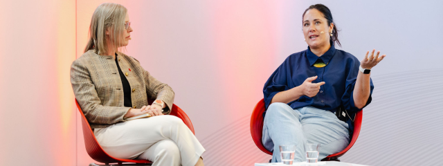 Kristina Logue and another speaker at The 2025 SUMMIT Idea Exchange stage