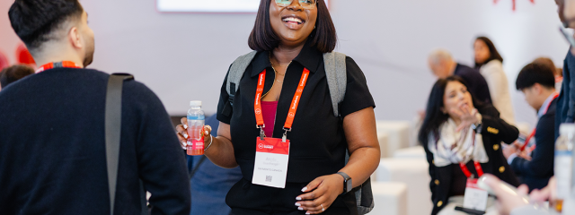 The 2026 SUMMIT: Payments Canada employee smiling