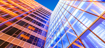 Brilliantly lit multicoloured exterior of office buildings