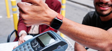 Person paying on the go with a wearable