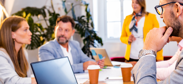 Group of professionals in a board room setting
