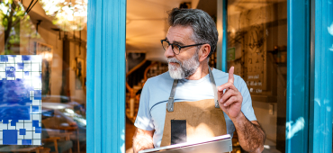 Shop owner smiling